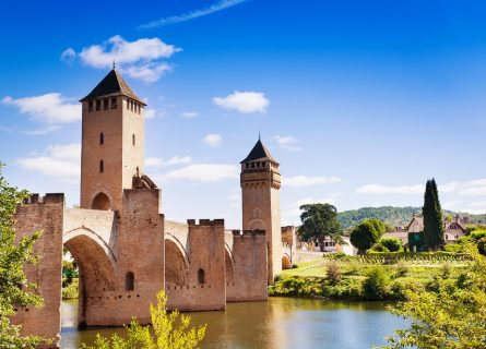 The Pont Valentré, a fortified stone arch bridge from the 14th century, spans six arches over the Lot River, situated to Cahors The Pont Valentré, a fortified stone arch bridge from the 14th century, spans six arches over the Lot River, situated to Cahors